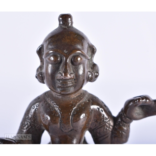 1587 - AN ANTIQUE INDIAN BRONZE FIGURE. 11cm high.