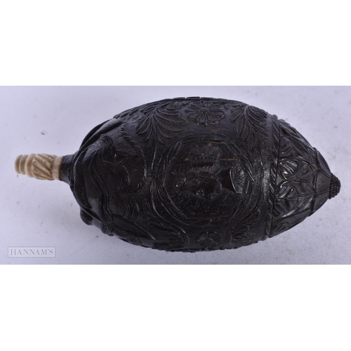 1950 - AN ANTIQUE BUGBEAR CARVED COCONUT FLASK. 64.6 grams. 15.5 cm x 7.25 cm.