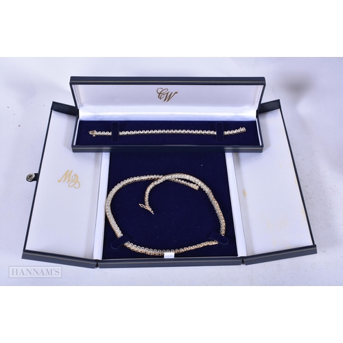 1964 - A LOVELY 9CT GOLD AND DIAMOND NECKLACE with matching bracelet. 36 grams. Necklace 45cm long, bracele... 