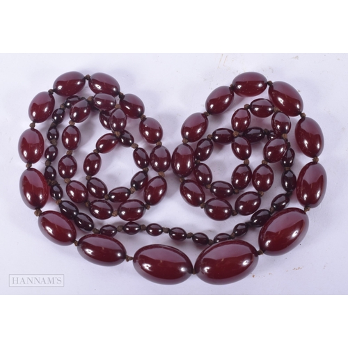 2652 - A CHERRY AMBER TYPE NECKLACE. 71 grams. 108 cm long.