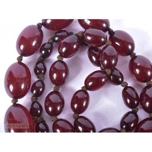 2652 - A CHERRY AMBER TYPE NECKLACE. 71 grams. 108 cm long.