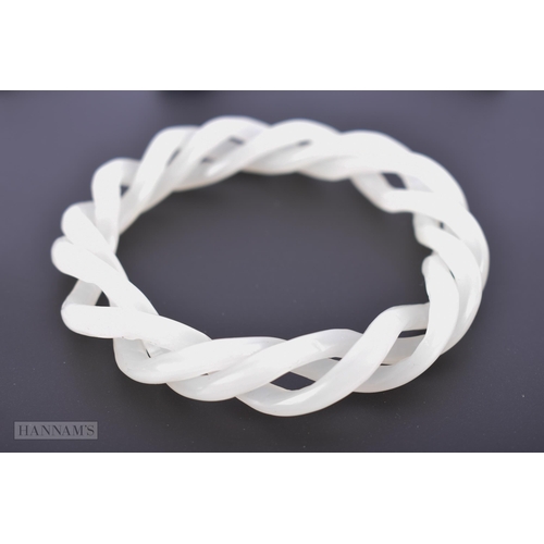 2655 - A CHINESE WHITE JADE TWIST BANGLE. 39.7 grams. 6.5 cm internal diameter.