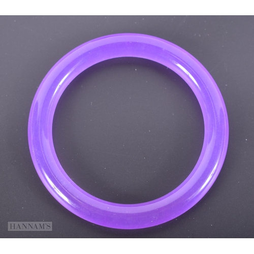 2657 - A CHINESE LAVENDER JADEITE BANGLE. 32.6 grams. 5.5 cm internal diameter.