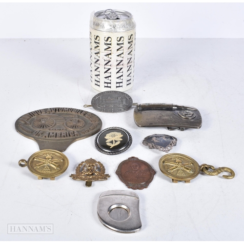 3009 - A collection of American and British military and railway related metal plaques, belt buckles,medall... 