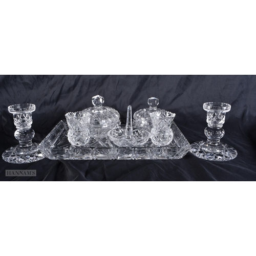 4125 - A CUT GLASS DRESSING TABLE SET. Largest 30 cm wide. (qty)