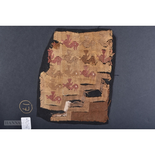 4126 - A COLLECTION OF EARLY TRIBAL MATERIAL FRAGMENTS in various forms. Each board 42cm x 28cm. (qty)