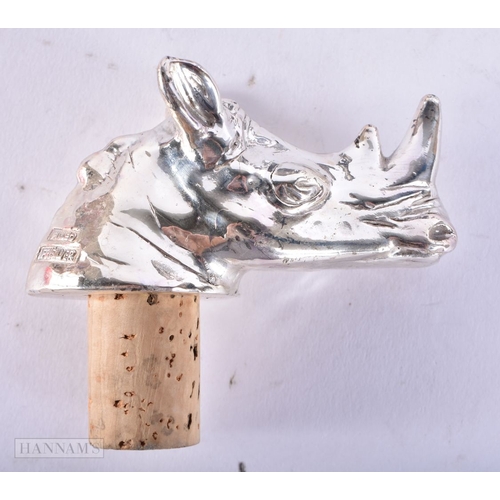 707 - A SILVER RHINOCEROS HEAD BOTTLE STOPPER together with two pairs of opera glasses. (3)