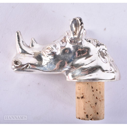 707 - A SILVER RHINOCEROS HEAD BOTTLE STOPPER together with two pairs of opera glasses. (3)