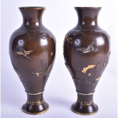 10 - A PAIR OF 19TH CENTURY JAPANESE MEIJI PERIOD GOLD AND SILVER ONLAID VASES decorated with birds perch... 