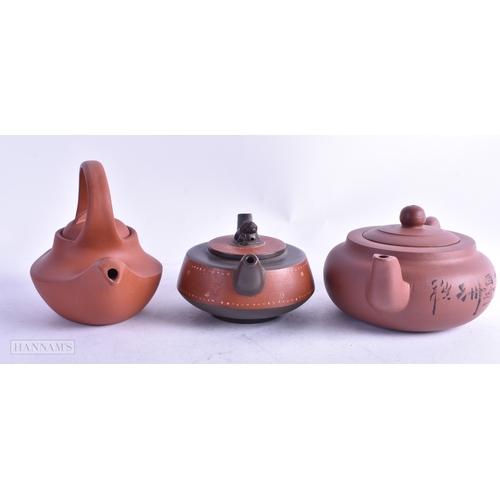 101 - THREE EARLY 20TH CENTURY CHINESE YIXING POTTERY TEAPOTS AND COVERS Late Qing/Republic. Largest 15 cm... 