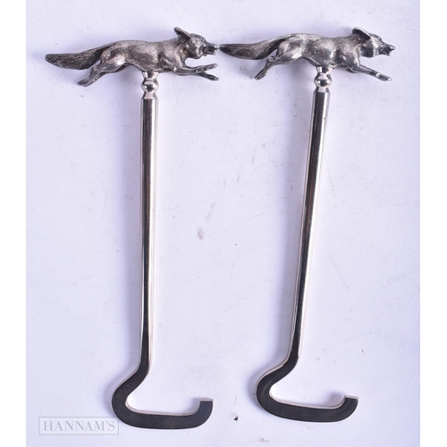 105 - A VERY RARE PAIR OF EARLY 20TH CENTURY ENGLISH SILVER SHOE HOOKS beautifully cast with roaming foxes... 