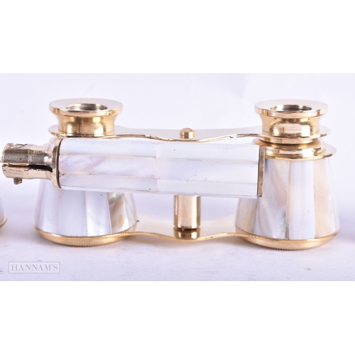 113 - A GROUP OF FOUR MOTHER OF PEARL OPERA GLASSES. Largest 18 cm wide extended. (4)