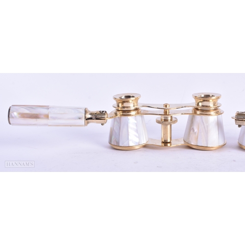 113 - A GROUP OF FOUR MOTHER OF PEARL OPERA GLASSES. Largest 18 cm wide extended. (4)