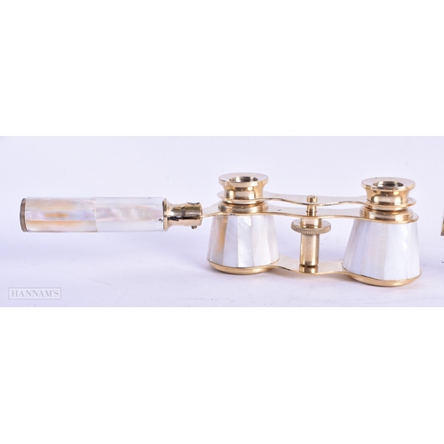 114 - A GROUP OF FOUR MOTHER OF PEARL OPERA GLASSES. Largest 18 cm wide extended. (4)