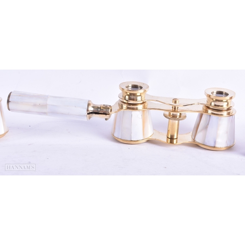 114 - A GROUP OF FOUR MOTHER OF PEARL OPERA GLASSES. Largest 18 cm wide extended. (4)