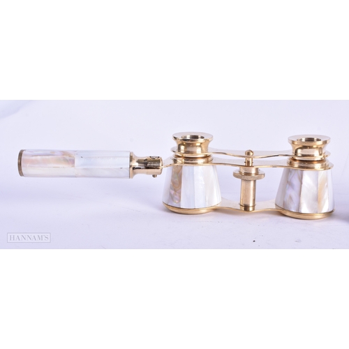 115 - A GROUP OF FOUR MOTHER OF PEARL OPERA GLASSES. Largest 18 cm wide extended. (4)