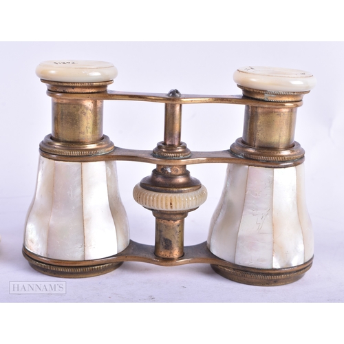 115 - A GROUP OF FOUR MOTHER OF PEARL OPERA GLASSES. Largest 18 cm wide extended. (4)