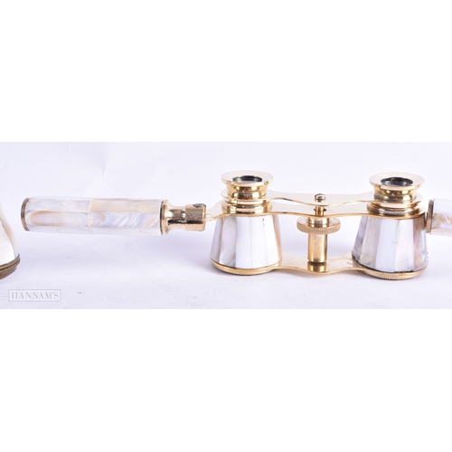 115 - A GROUP OF FOUR MOTHER OF PEARL OPERA GLASSES. Largest 18 cm wide extended. (4)