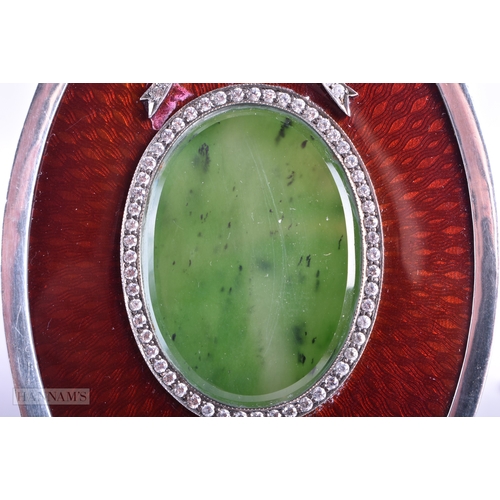 117 - A FINE PAIR OF RUSSIAN SILVER AND ENAMEL PHOTOGRAPH FRAMES with nephrite jade backings, the fronts d... 