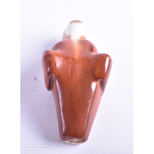 122 - A RARE ROYAL WORCESTER PORCELAIN DOG WHISTLE. 3.75 cm x 2 cm.