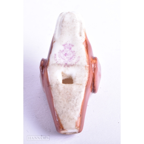 122 - A RARE ROYAL WORCESTER PORCELAIN DOG WHISTLE. 3.75 cm x 2 cm.