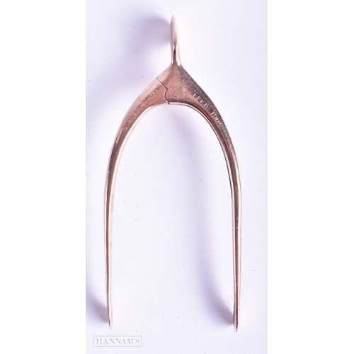 123 - A PAIR OF 9CT GOLD WISHBONE TONGS. 18.3 grams. 8.5 cm x 3.5 cm.