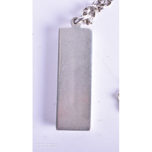 141 - A SILVER INGOT NECKLACE. 41.4 grams. Sheffield 1977. Chain 50 cm long, pendant 4.25 cm x 1.5 cm.