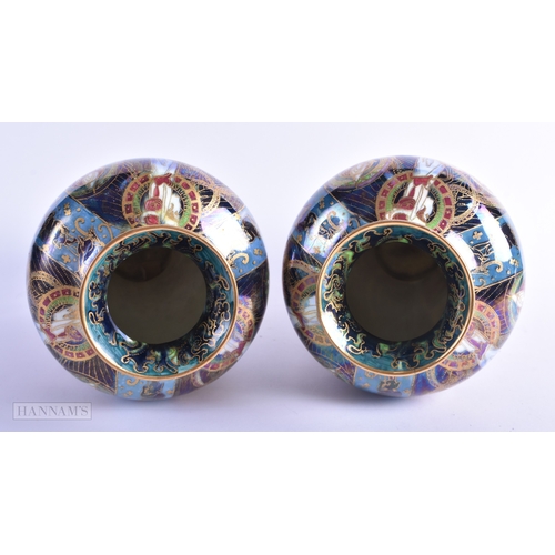 160 - A FINE PAIR OF WEDGWOOD FAIRYLAND LUSTRE VASES by Daisy Makeig Jones. 22 cm x 11 cm.