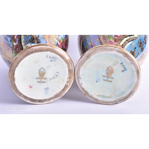 160 - A FINE PAIR OF WEDGWOOD FAIRYLAND LUSTRE VASES by Daisy Makeig Jones. 22 cm x 11 cm.