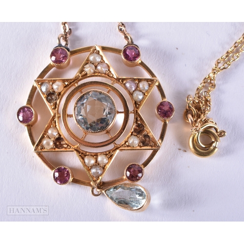 162 - A VICTORIAN 15CT GOLD AQUAMARINE RUBY AND SEED PEARL NECKLACE. 6.3 grams. 48 cm long, pendant 3.5 cm... 