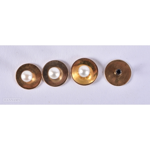 165 - A SET OF FOUR EDWARDIAN 18CT GOLD AND PEARL DRESS STUDS. 3.3 grams. 1 cm diameter. (4)