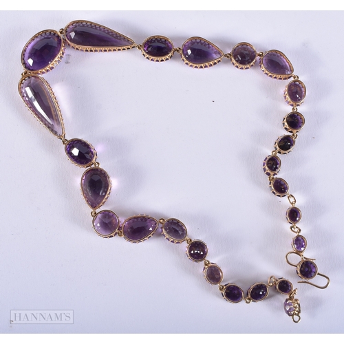 173 - A FINE VICTORIAN 15CT GOLD AND AMETHYST NECKLACE formed with graduated oval, pear and circular shape... 