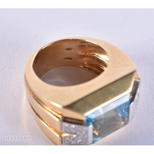 177 - A FINE 18CT GOLD BLUE TOPAZ AND DIAMOND VERSACE RING. 25 grams. Topaz 1.25 cm x 1 cm.