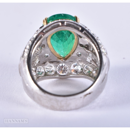 178 - A FINE 18CT WHITE GOLD PEAR SHAPED EMERALD AND DIAMOND RING. 16.1 grams. Emerald 1.5 cm x 0.75 cm.