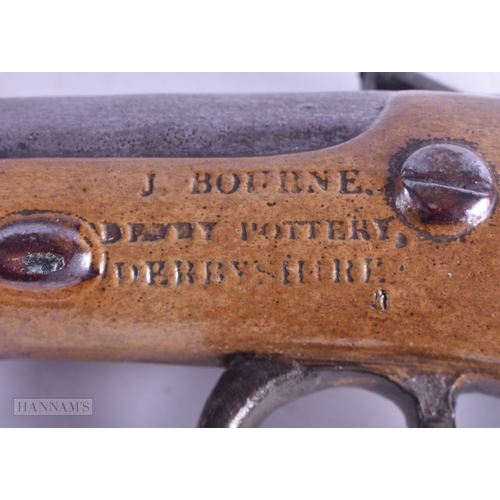 18 - A SMALLER EARLY 19TH CENTURY ENGLISH SALT GLAZED PISTOL WHISKEY FLASK by J Bourne of Derbyshire. 25 ... 