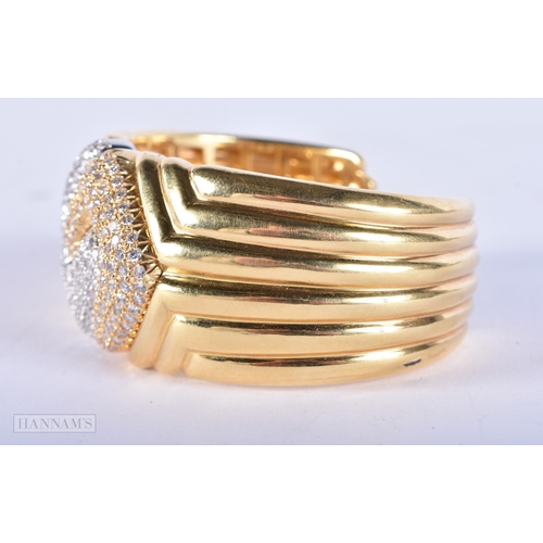 185 - A FINE 18CT GOLD AND DIAMOND CUFF BANGLE. 109.7 grams. 7.5 cm wide.