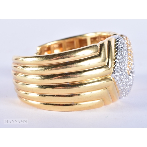 185 - A FINE 18CT GOLD AND DIAMOND CUFF BANGLE. 109.7 grams. 7.5 cm wide.