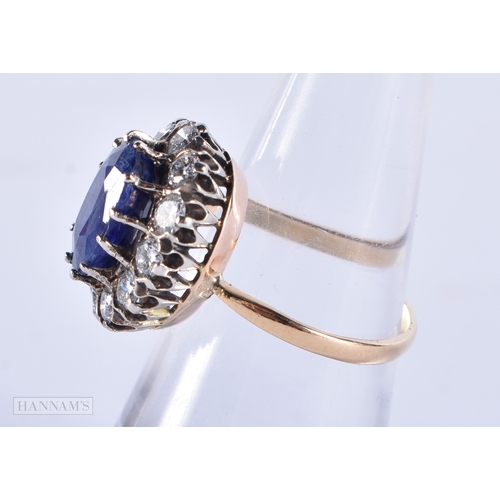 187 - A FINE 18CT SAPPHIRE AND DIAMOND CLUSTER RING. 5.1 grams. Sapphire 1 cm x 0.5 cm.