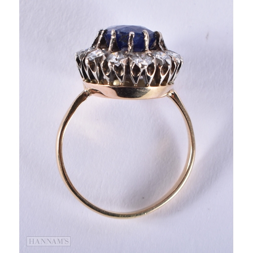 187 - A FINE 18CT SAPPHIRE AND DIAMOND CLUSTER RING. 5.1 grams. Sapphire 1 cm x 0.5 cm.