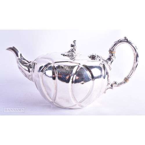 19 - AN EARLY VICTORIAN SILVER TEAPOT mounted with a seated Chinese male. London 1845. 516 grams. 24 cm x... 