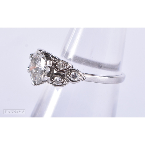 194 - A LOVELY PLATINUM AND DIAMOND SOLITAIRE RING. The central stone is approx 1.75cts. 4 grams.