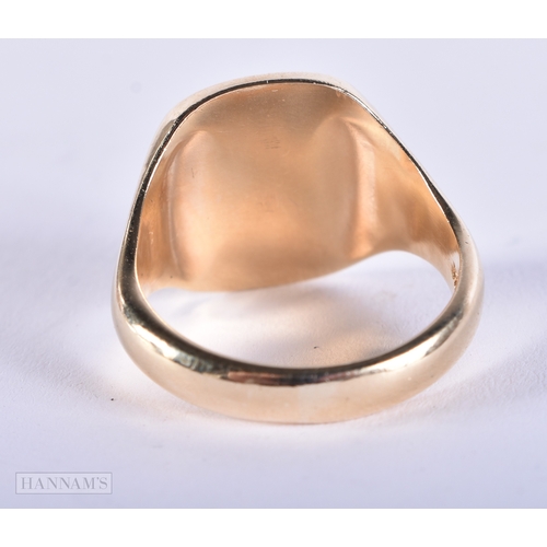 195 - A 9CT GOLD TALBOT DOG INTAGLIO RING. 9.1 grams.