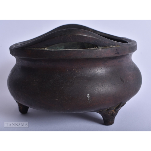 202 - A CHINESE QING DYNASTY TWIN HANDLED BRONZE CENSER bearing Ming inscription to inner body. 759 grams.... 