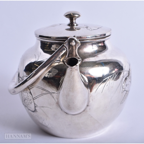 203 - A FINE 19TH CENTURY JAPANESE MEIJI PERIOD SILVER TEAPOT decorated with game birds and foliage. 231 g... 