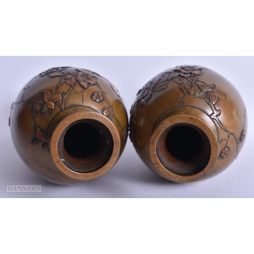 217 - A PAIR OF 19TH CENTURY JAPANESE MEIJI PERIOD NAGOYA BRONZE VASES onlaid in silver with birds amongst... 