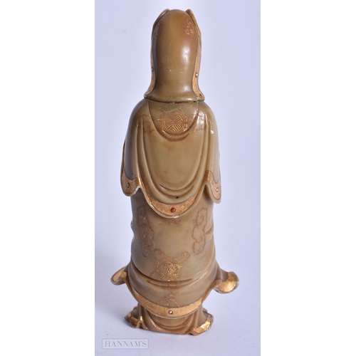 220 - A CHINESE QING DYNASTY GILDED SOAPSTONE FIGURE OF GUANYIN. 16 cm high.