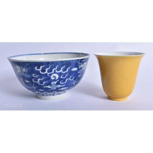 229 - A CHINESE QING DYNASTY IMPERIAL YELLOW GLAZED FLARED BEAKER together with a similar blue and white b... 