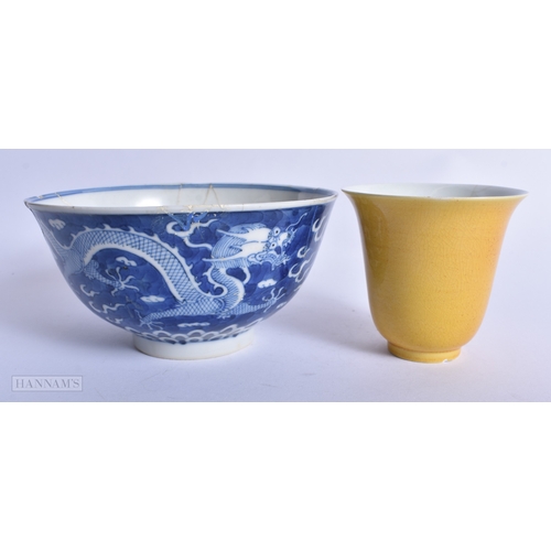 229 - A CHINESE QING DYNASTY IMPERIAL YELLOW GLAZED FLARED BEAKER together with a similar blue and white b... 