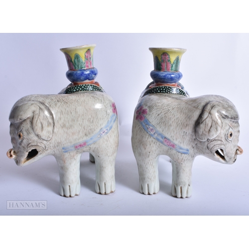 239 - A PAIR OF 19TH CENTURY CHINESE FAMILLE ROSE PORCELAIN ELEPHANTS Qing. 16 cm x 14 cm.