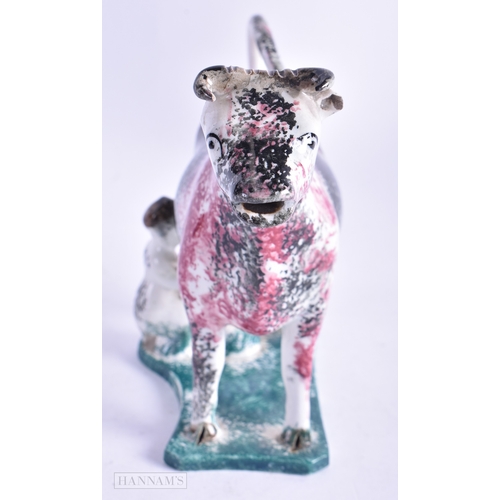 29 - AN UNUSUAL EARLY 19TH CENTURY BRITISH SPONGEWARE POTTERY COW CREAMER modelled with a milking female.... 